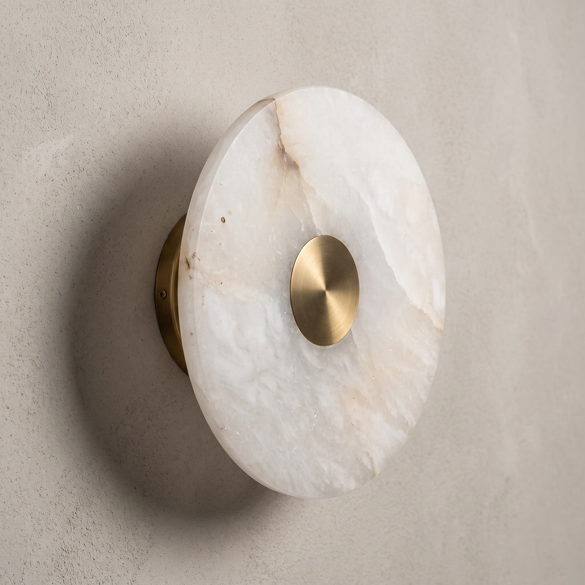 AX318 minimalist round wall sconce, side view showing the brass wall mount behind the alabaster disc