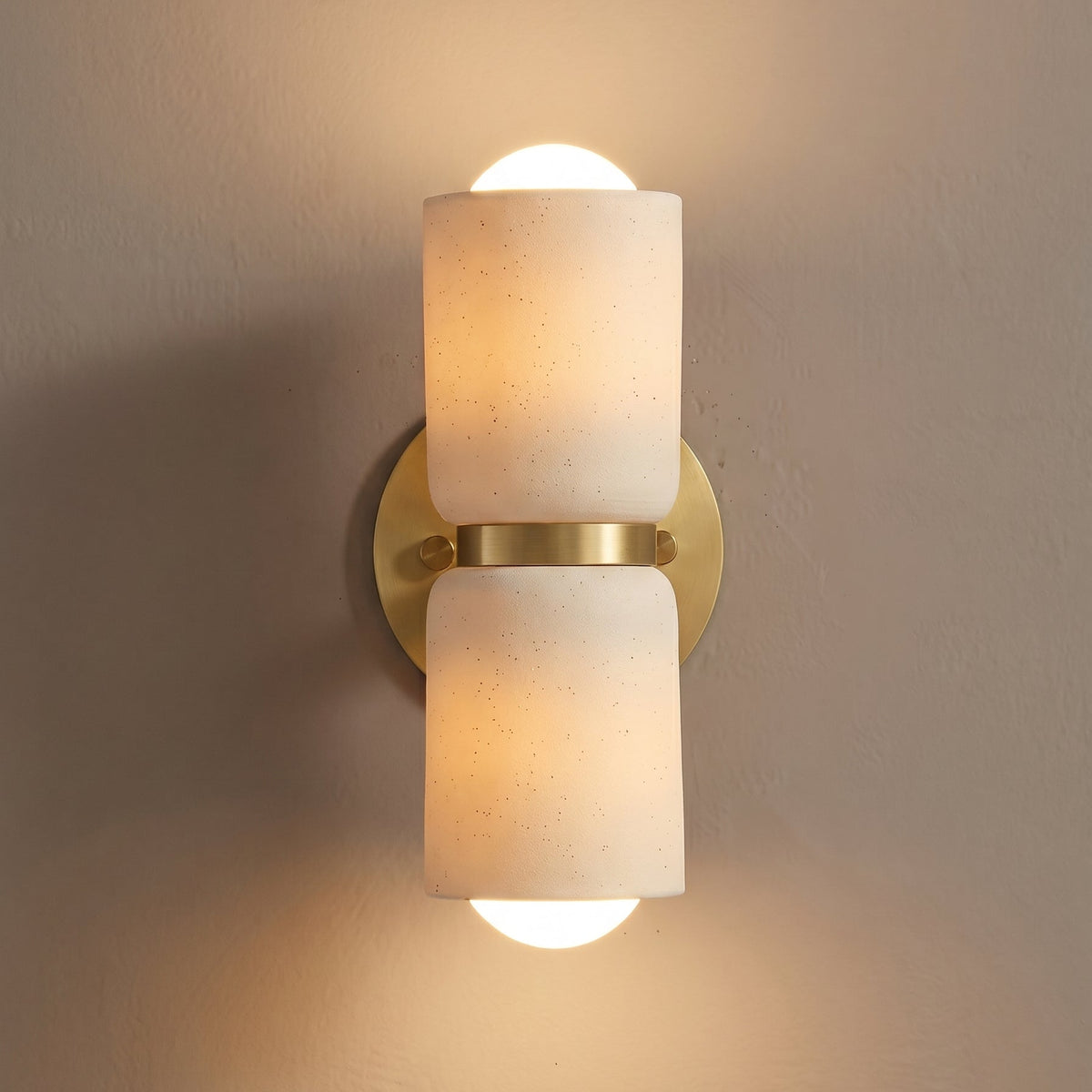 AX163 up down wall sconce lit, warm light washing up and down from glowing ceramic shades