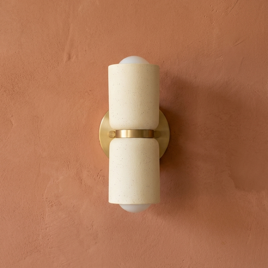 AX163 ceramic wall sconce with brass mount on a terracotta plaster wall, modern up down wall light