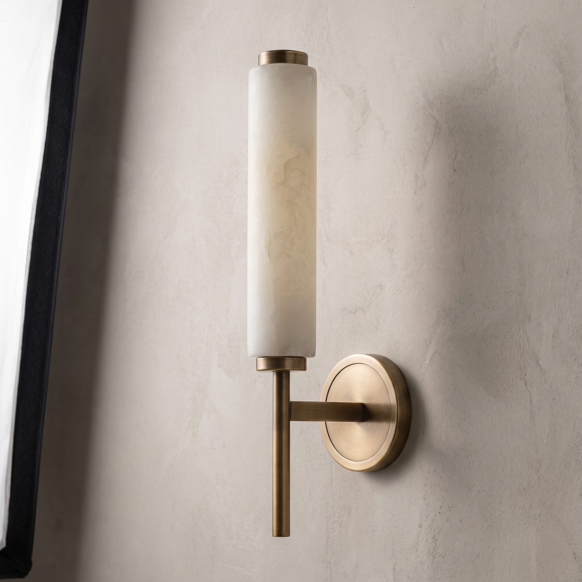 AX290 alabaster wall sconce with antique brass arm and round backplate, modern tall wall light