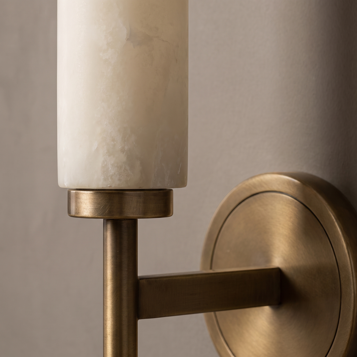 Antique brass wall sconce detail, AX290 alabaster cylinder shade on a brushed brass stem
