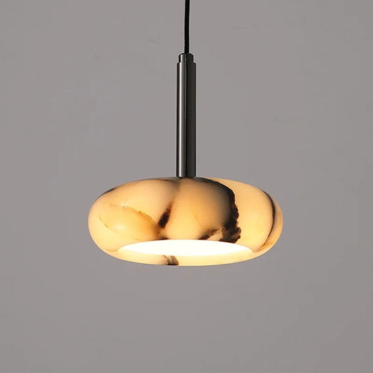 Gold pendant light on a gray background